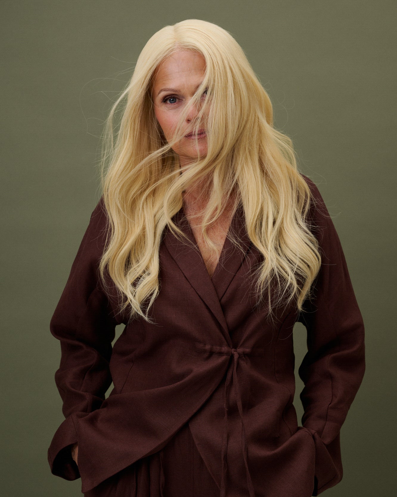 Model front view wearing Livia Wig – 40cm full lace wig in light warm blonde; 100% Remy hair with HD lace and pre-plucked hairline; styled with natural layers.