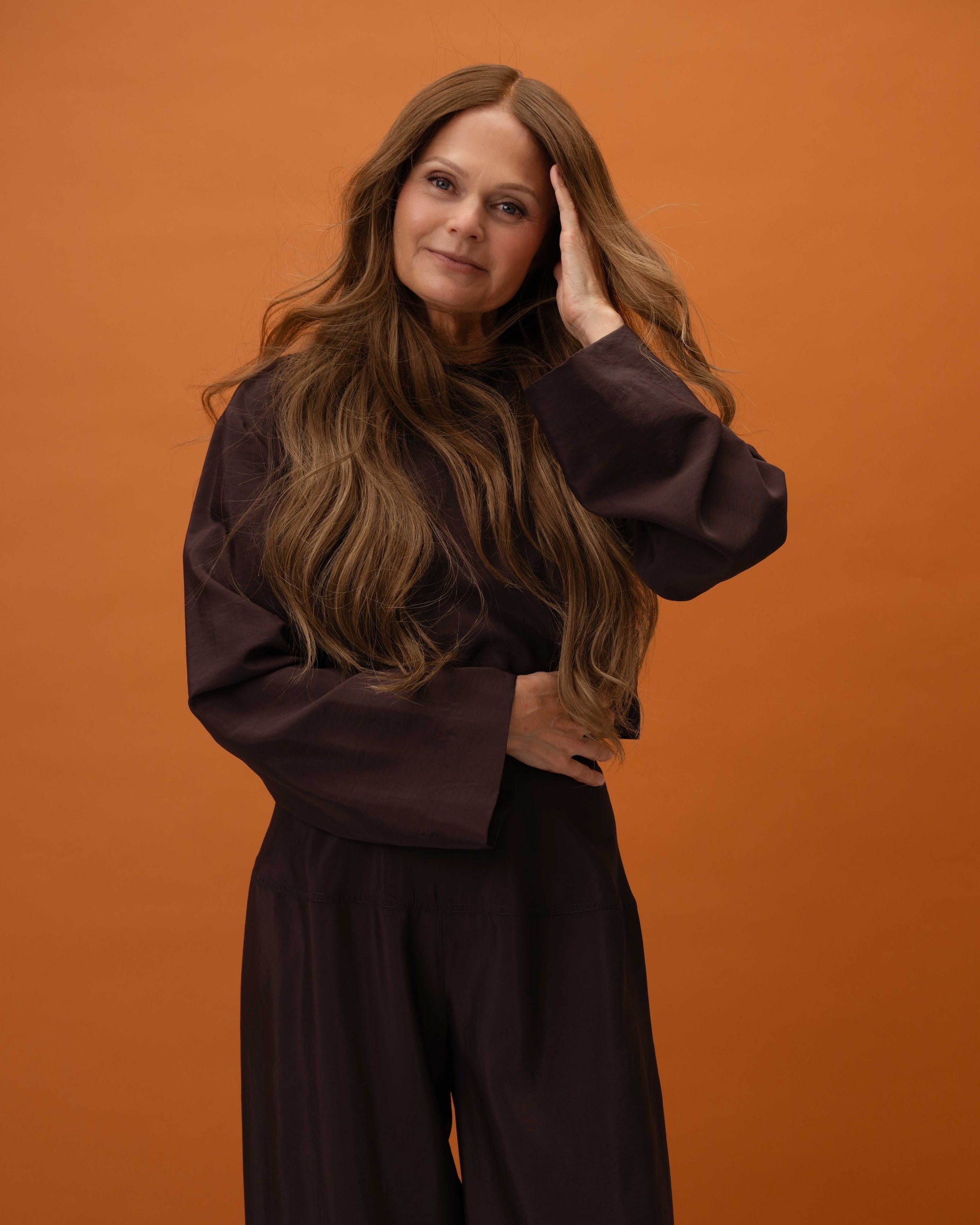 Model front view with Elena Wig – 50cm balayage lace wig with caramel brown roots blending into cool medium brown lengths; 100% Remy hair with HD lace.