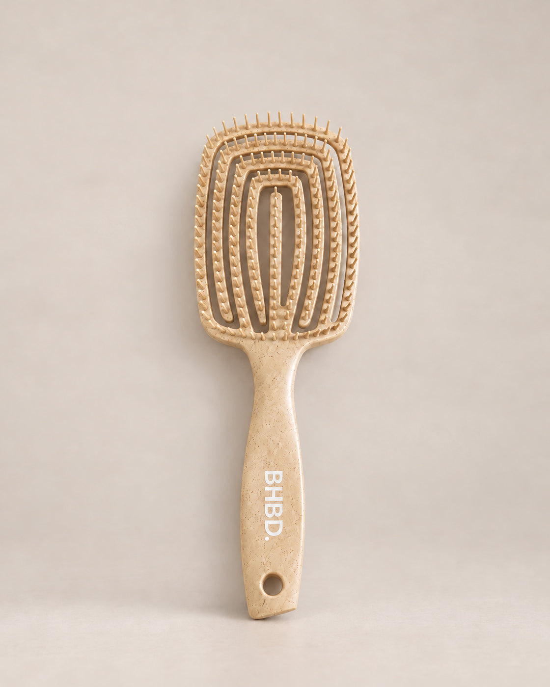 Wet detangler brush with flexible bristles designed to gently detangle wet and dry hair.