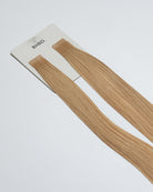 Tape Extensions 10NB – pre-taped Remy human hair extensions in light natural beige blonde shade; seamless, soft and tangle-free; comes in 35cm, 50cm, and 60cm. 100% Remy hair, gentle extensions.