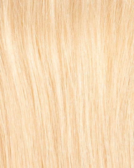 Close-up of hair topper in shade 12N, light blond color with natural texture and shine.