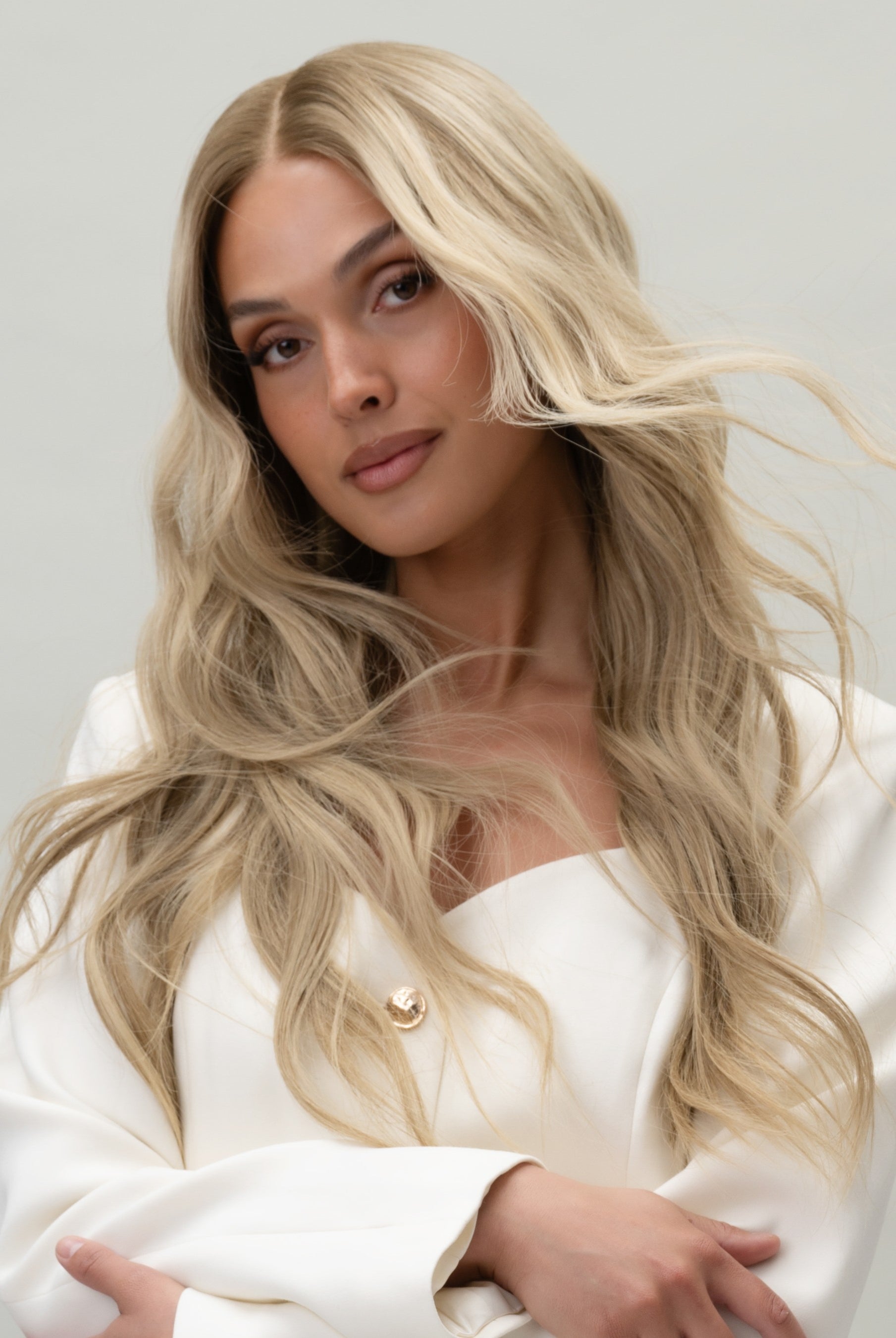 Scarlet Wig 50 cm natural blonde human hair wig with dark blonde root and soft lowlights for depth and realism, shown on model.