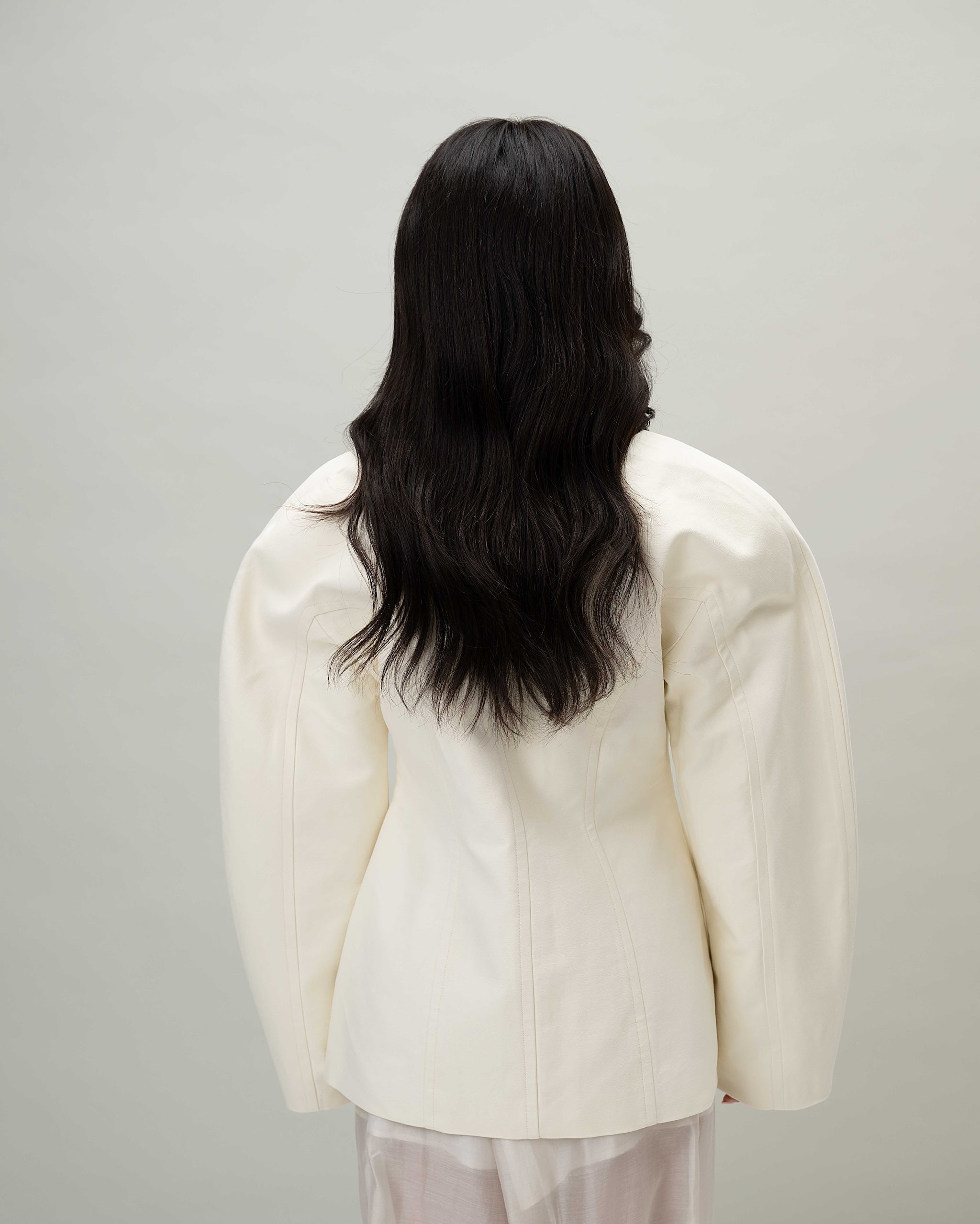 Back view on model with Aurora Wig – 40cm black Remy hair lace wig, shown from the back with layered lengths and natural scalp effect.