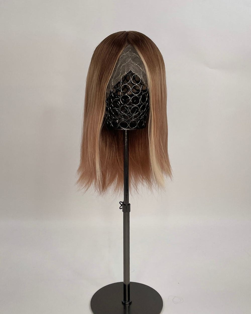 Sophia Wig – medium brown with subtle highlights, 30cm full-lace wig; 100% Remy hair with transparent Swiss lace; shown on wid stand.