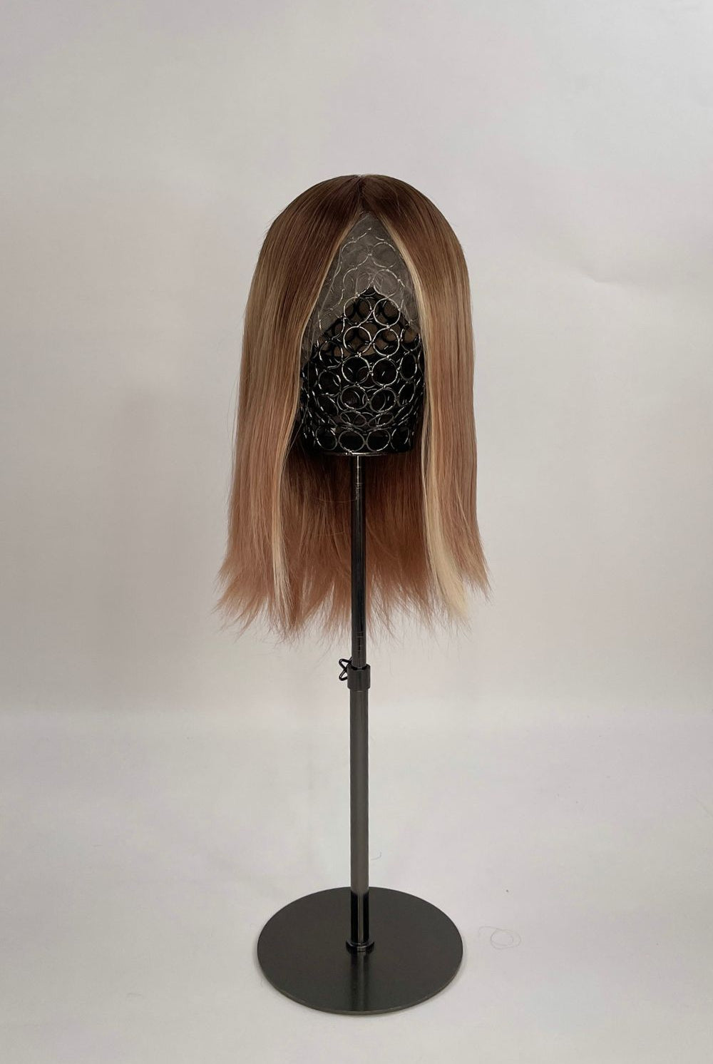 Sophia Wig – medium brown with subtle highlights, 30cm full-lace wig; 100% Remy hair with transparent Swiss lace; shown on wid stand.
