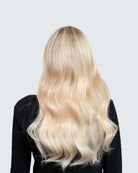 Showing beautiful blond hair from the back with Hairband 12N – Halo hair extensions in light natural blonde; fuller & longer hair in 60 seconds; 40cm/16 inch. 100% Remy hair, gentle extensions.