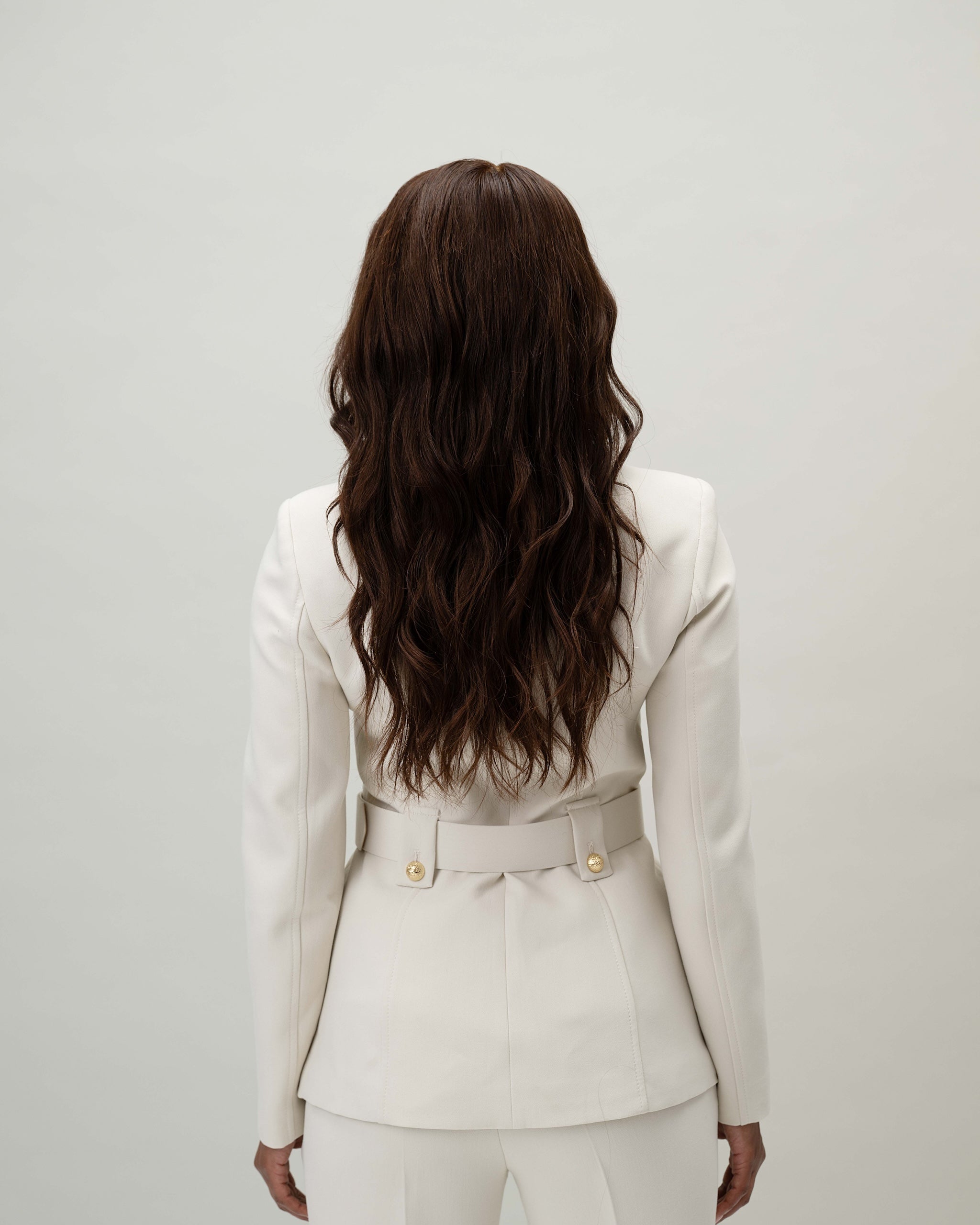 model wearing Valentina Wig – 40cm dark brown Remy hair lace wig with pre-plucked hairline and bleached knots for realistic scalp and parting. Shown from the back.