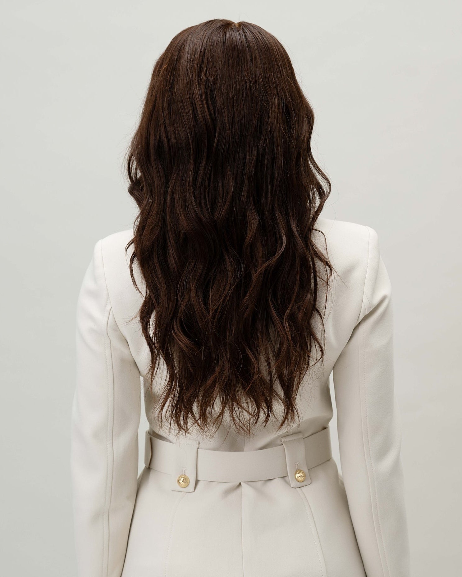 model wearing Valentina Wig – 40cm dark brown Remy hair lace wig with pre-plucked hairline and bleached knots for realistic scalp and parting. Shown from the back.