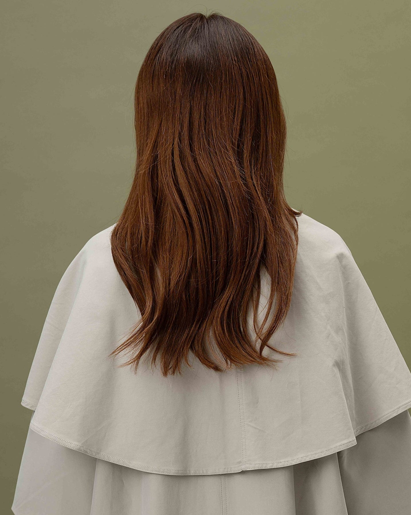 Ava Wig 40 cm Remy human hair wig with dark copper roots blending into lighter copper lengths, softly layered and shown from back