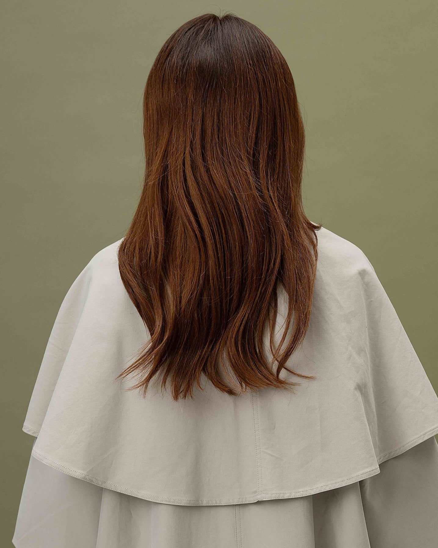 Ava Wig 40 cm Remy human hair wig with dark copper roots blending into lighter copper lengths, softly layered and shown from back