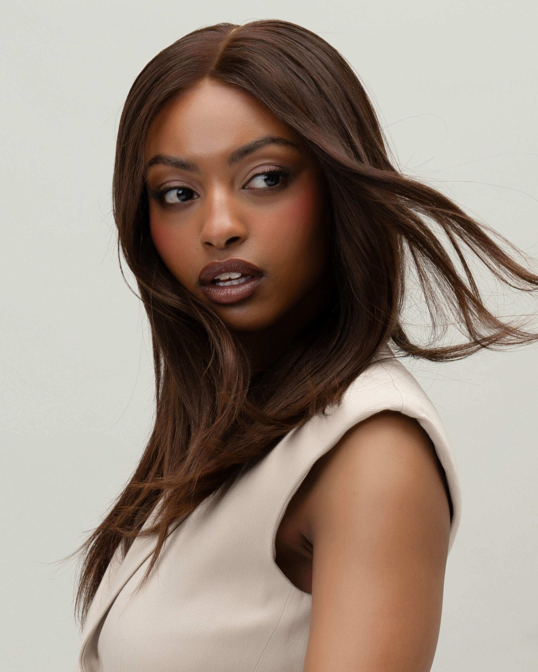 Peony Wig 30 cm dark brown human hair wig with natural face-framing design and soft cropped length, shown on model for a natural look.
