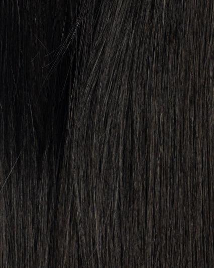 Close-up of hair topper in shade 2N, dark brown/black color with natural texture and shine.