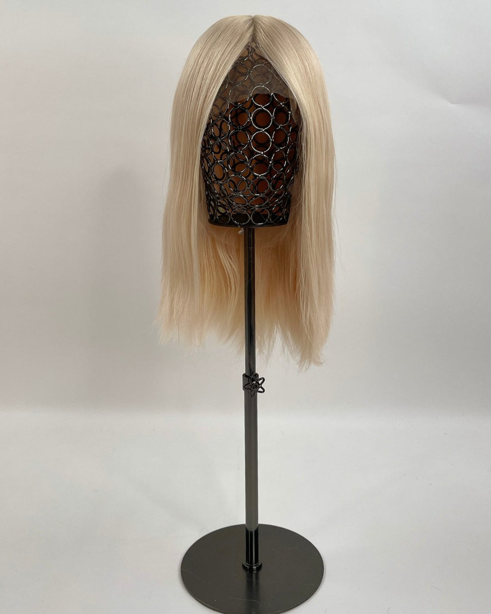 Bianca Wig – light blonde, 30cm full-lace wig; 100% Remy hair with transparent Swiss lace and natural density on a wig stand.