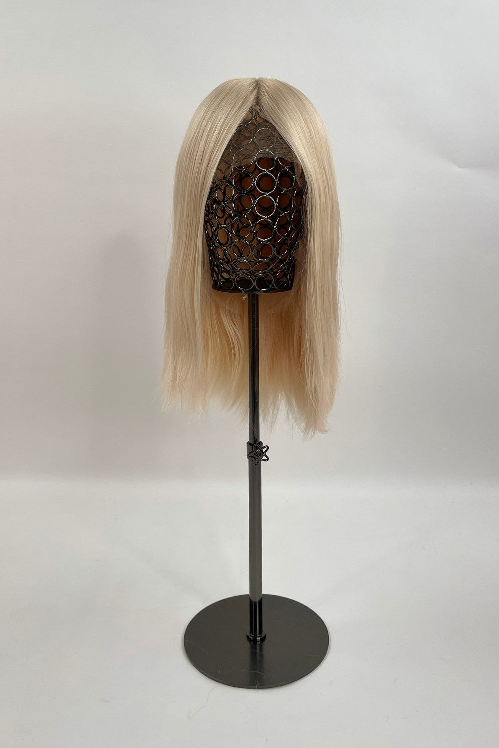 Bianca Wig – light blonde, 30cm full-lace wig; 100% Remy hair with transparent Swiss lace and natural density on a wig stand.