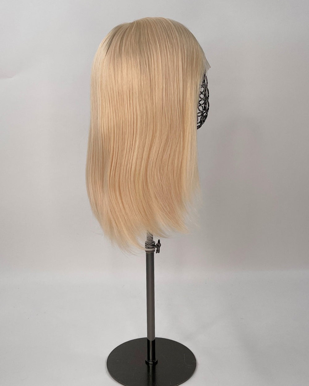 Bianca Wig – light blonde, 30cm full-lace wig; 100% Remy hair with transparent Swiss lace and natural density on a wig stand from the side