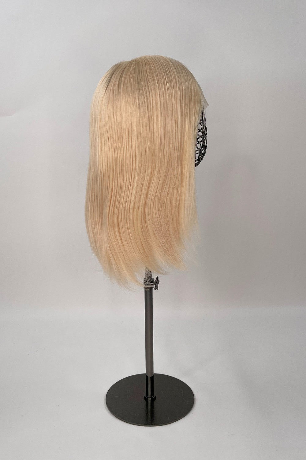 Bianca Wig – light blonde, 30cm full-lace wig; 100% Remy hair with transparent Swiss lace and natural density on a wig stand from the side