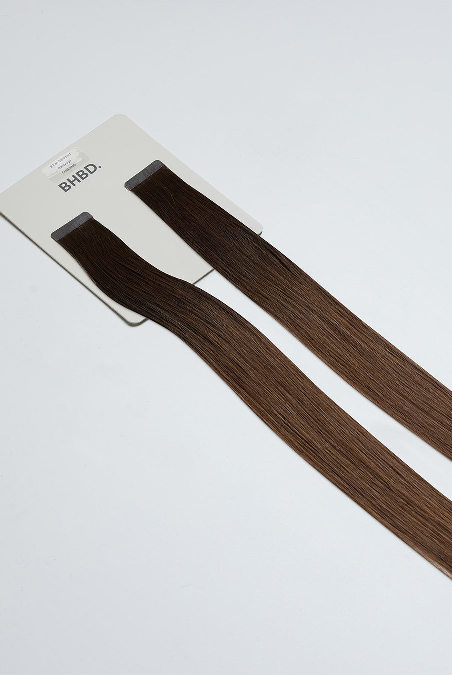 Tape Extensions 5NG/6NG – pre-taped Remy human hair extensions in natural golden brown shades; seamless, soft and tangle-free; comes in 35cm, 50cm, and 60cm. 100% Remy hair, gentle extensions.