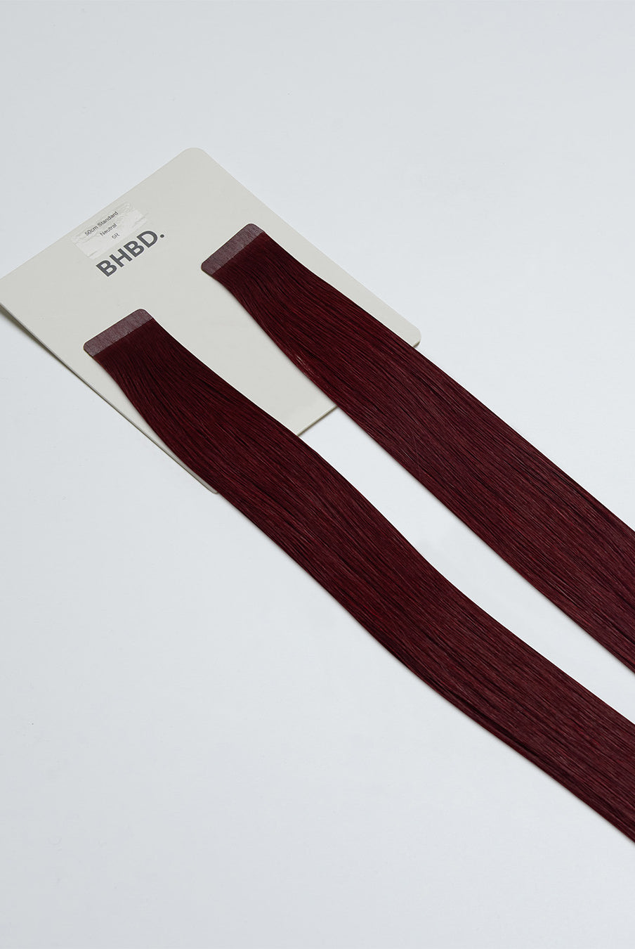 Tape Extensions 5R – pre-taped Remy human hair extensions in medium red shade; seamless, soft and tangle-free; comes in 35cm, 50cm, and 60cm. 100% Remy hair, gentle extensions.