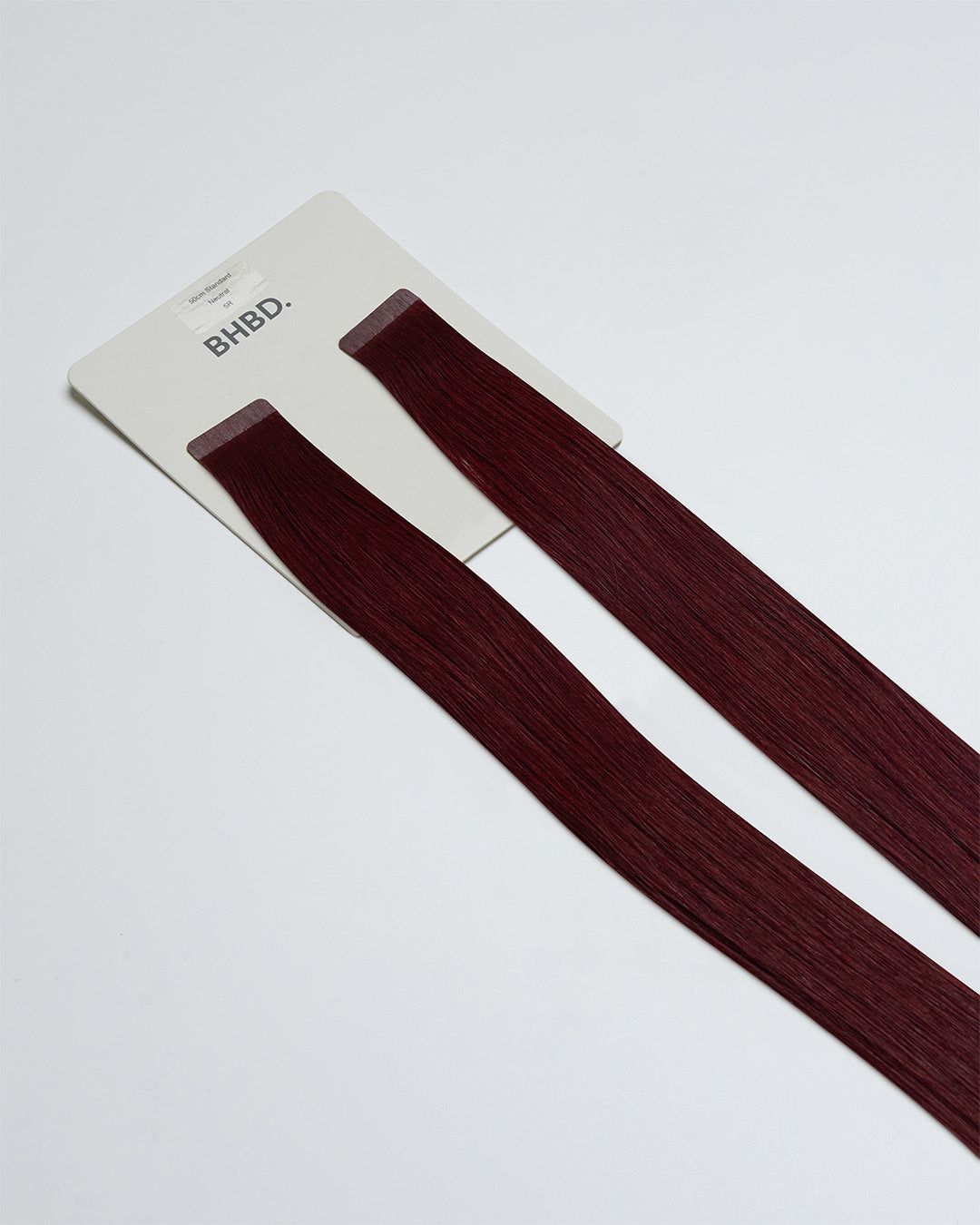 Tape Extensions 5R – pre-taped Remy human hair extensions in medium red shade; seamless, soft and tangle-free; comes in 35cm, 50cm, and 60cm. 100% Remy hair, gentle extensions.