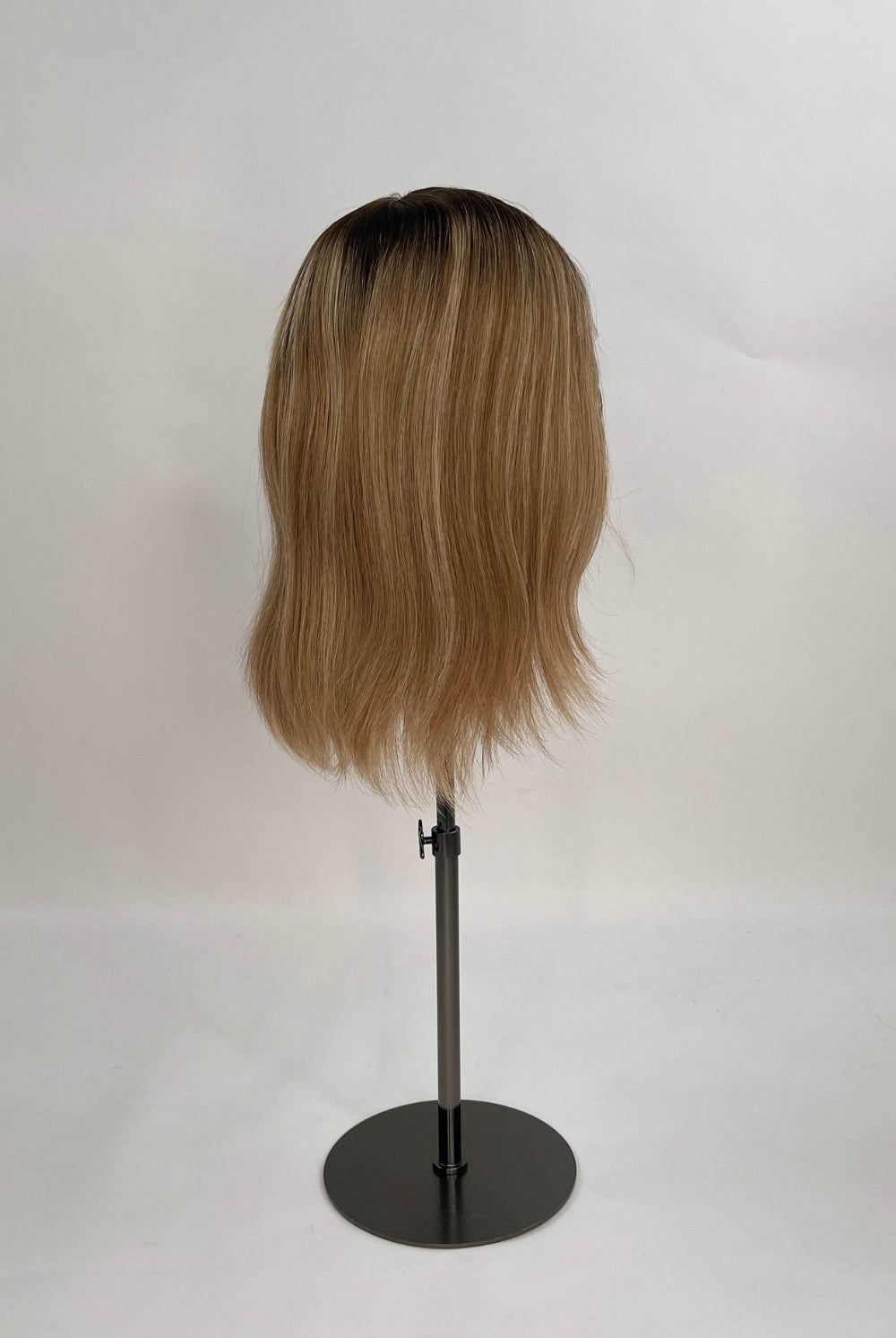 Serena Wig – dark brown root lighter brown lengths, 30cm full-lace wig; 100% Remy hair with transparent Swiss lace; shown on wig stand from side.