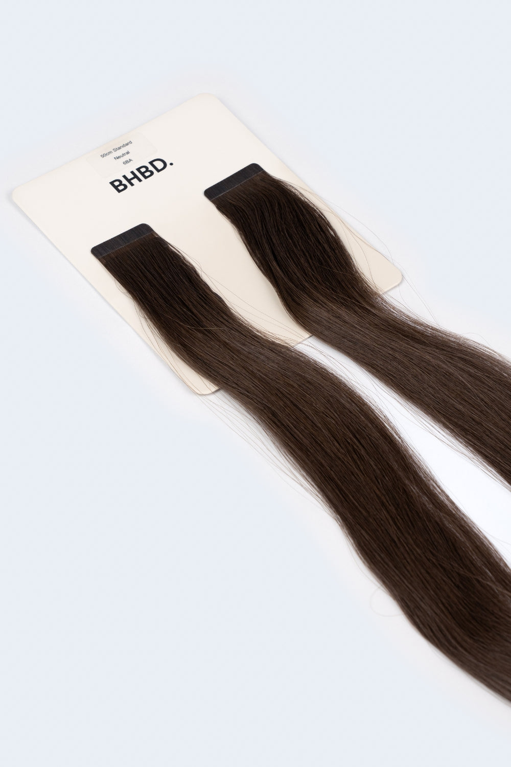 BHBD Tape Extensions 6BA – pre-taped Remy human hair extensions in rich ash brown shade; seamless, soft and tangle-free; comes in 35cm, 50cm, and 60cm. 100% Remy hair, gentle extensions.