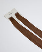 Tape Extensions 6N – pre-taped Remy human hair extensions in medium natural brown shade; seamless, soft and tangle-free; comes in 35cm, 50cm, and 60cm. 100% Remy hair, gentle extensions.