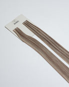 Tape Extensions 8A/12N – pre-taped Remy human hair extensions in medium ash blonde blended with light natural blonde; seamless, soft and tangle-free; comes in 35cm, 50cm, and 60cm. 100% Remy hair, gentle extensions.