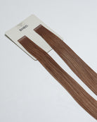 Tape Extensions 8P – pre-taped Remy human hair extensions in pearl medium blonde shade; seamless, soft and tangle-free; comes in 35cm, 50cm, and 60cm. 100% Remy hair, gentle extensions.