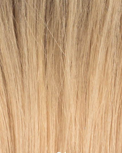 Close-up of hair topper in shade 9BA/12N-R, blond shade with darker roots and light blond lengths with natural texture and shine.