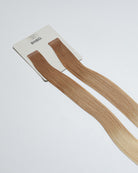 Tape Extensions 9NG/11N – pre-taped Remy human hair extensions in golden natural blonde blended with medium natural blonde; seamless, soft and tangle-free; comes in 35cm, 50cm, and 60cm. 100% Remy hair, gentle extensions.