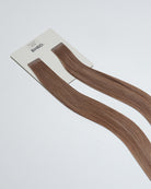 Tape Extensions 8PV/10BP – pre-taped Remy human hair extensions in pearl violet blonde and beige pearl tones; seamless, soft and tangle-free; comes in 35cm, 50cm, and 60cm. 100% Remy hair, gentle extensions.