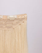 Close-up of BHBD hairband clip: hook & fishing line for adjustability.