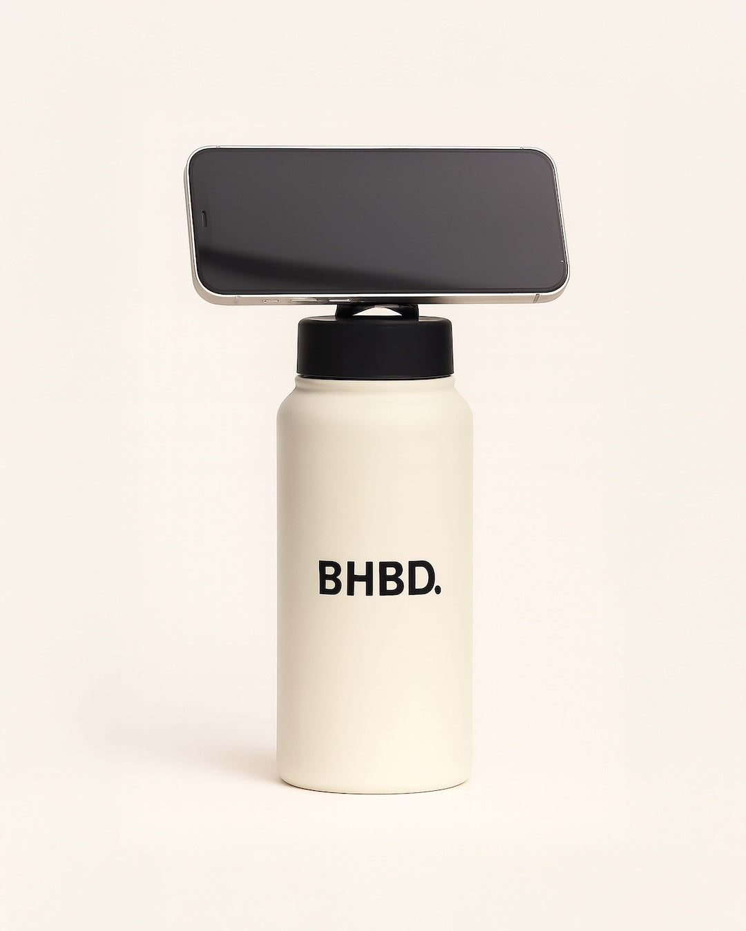 White bottle with 'BHBD.' branding and a smartphone on top against a white background