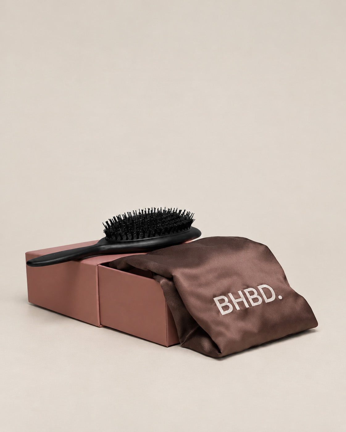 BHBD beauty sleep set with hair brush and satin bonnet for hair care on grey background