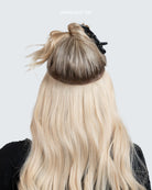 How a BHBD Hairband is applied on the back of a head on a woman.