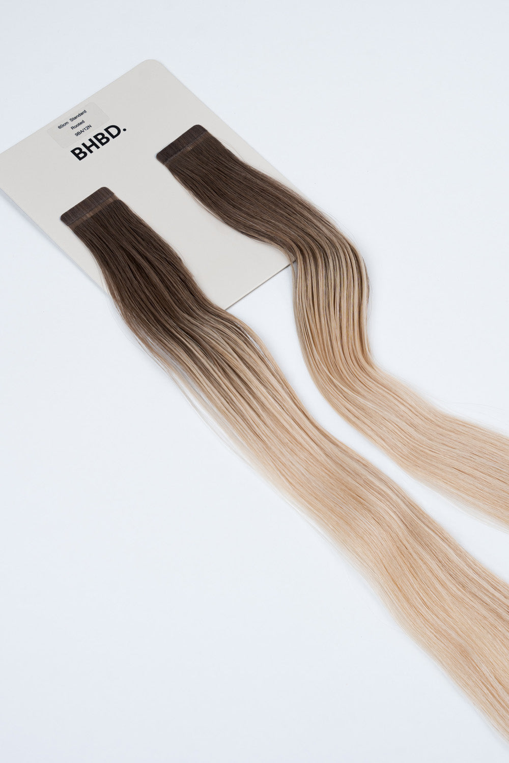 BHBD Tape Extensions 9BA/12N Rooted – pre-taped Remy human hair extensions with darker roots blending into soft blonde lengths; seamless, soft and tangle-free; comes in 35cm, 50cm, and 60cm. 100% Remy hair, gentle extensions.