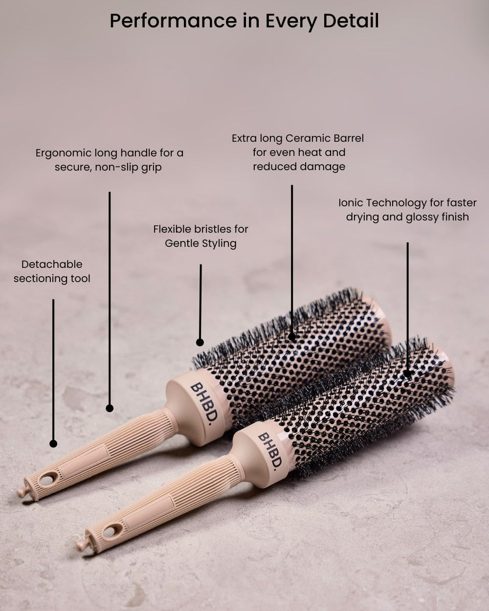 BHBD round brushes placed on a neutral surface, highlighting their ergonomic long handles, detachable sectioning tools, ceramic barrels, flexible bristles, and ionic technology for professional styling and reduced frizz.