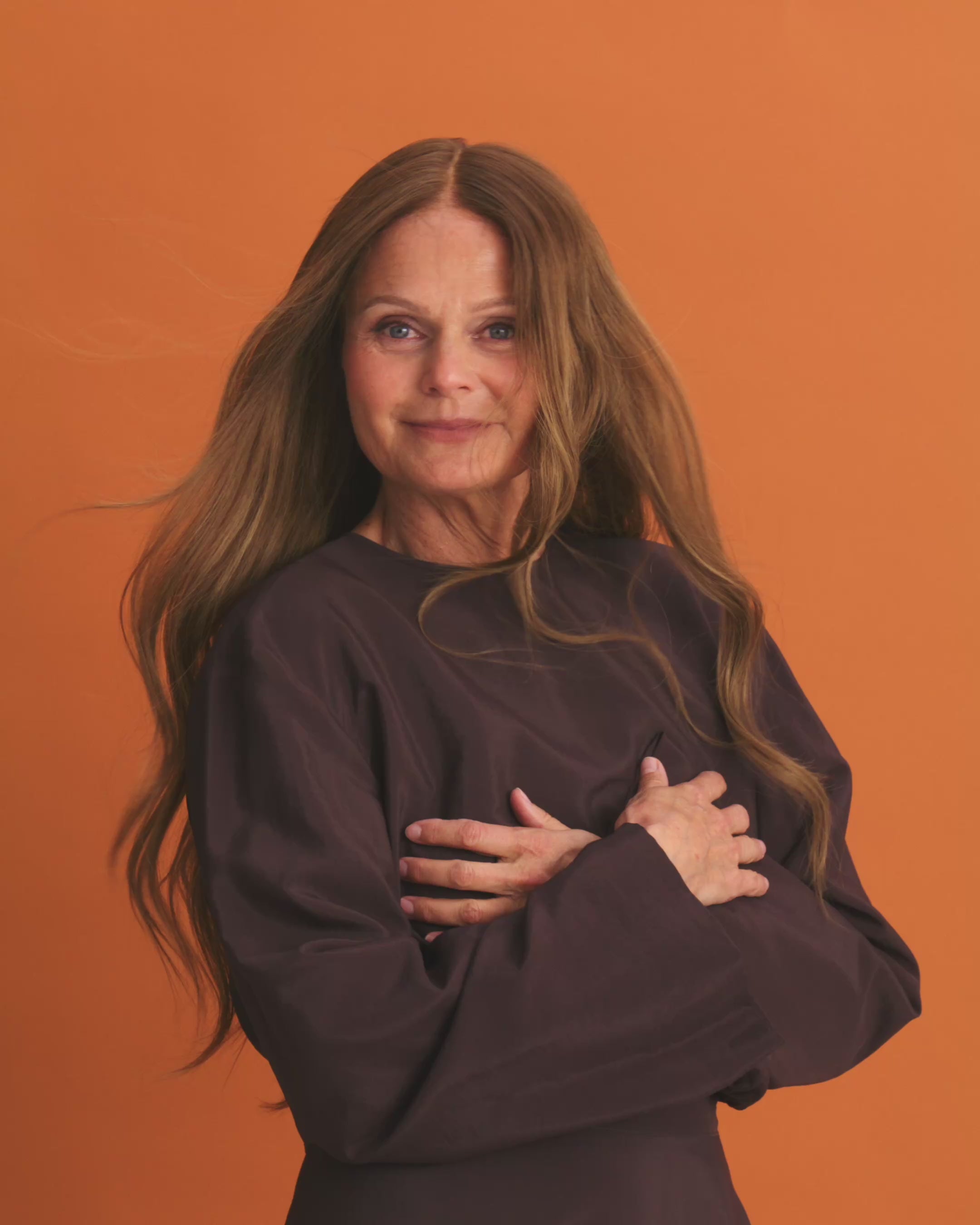 Model close-up demonstrating the wig’s realistic look and natural hair movement. Elena Wig – 50cm balayage full lace wig in caramel to cool brown blend; pre-plucked hairline and bleached knots for natural scalp look.