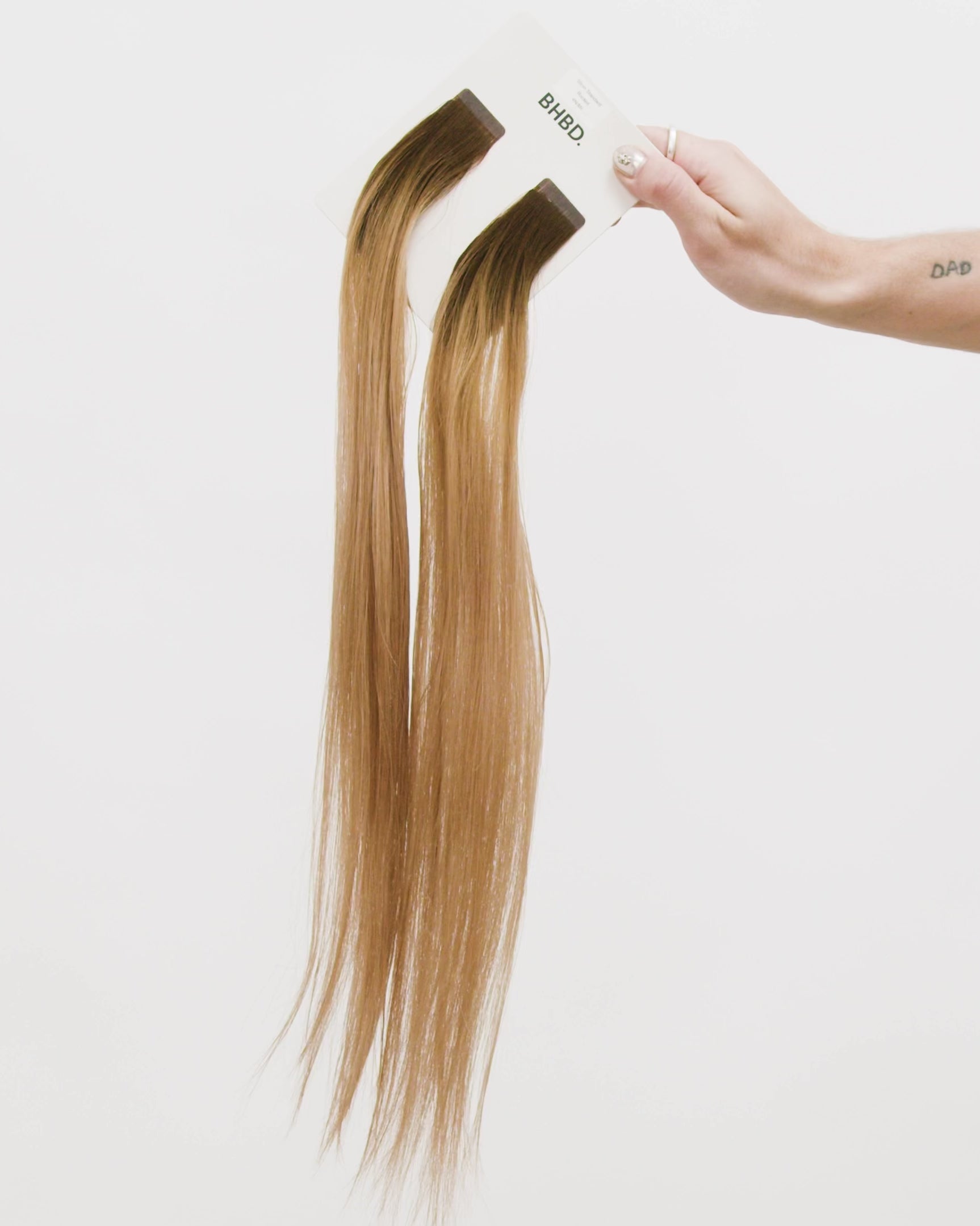 Tape Extensions 4N/8N – pre-taped Remy human hair extensions in dark brown blended with medium natural blonde; seamless, soft and tangle-free; comes in 35cm, 50cm, and 60cm. 100% Remy hair, gentle extensions.