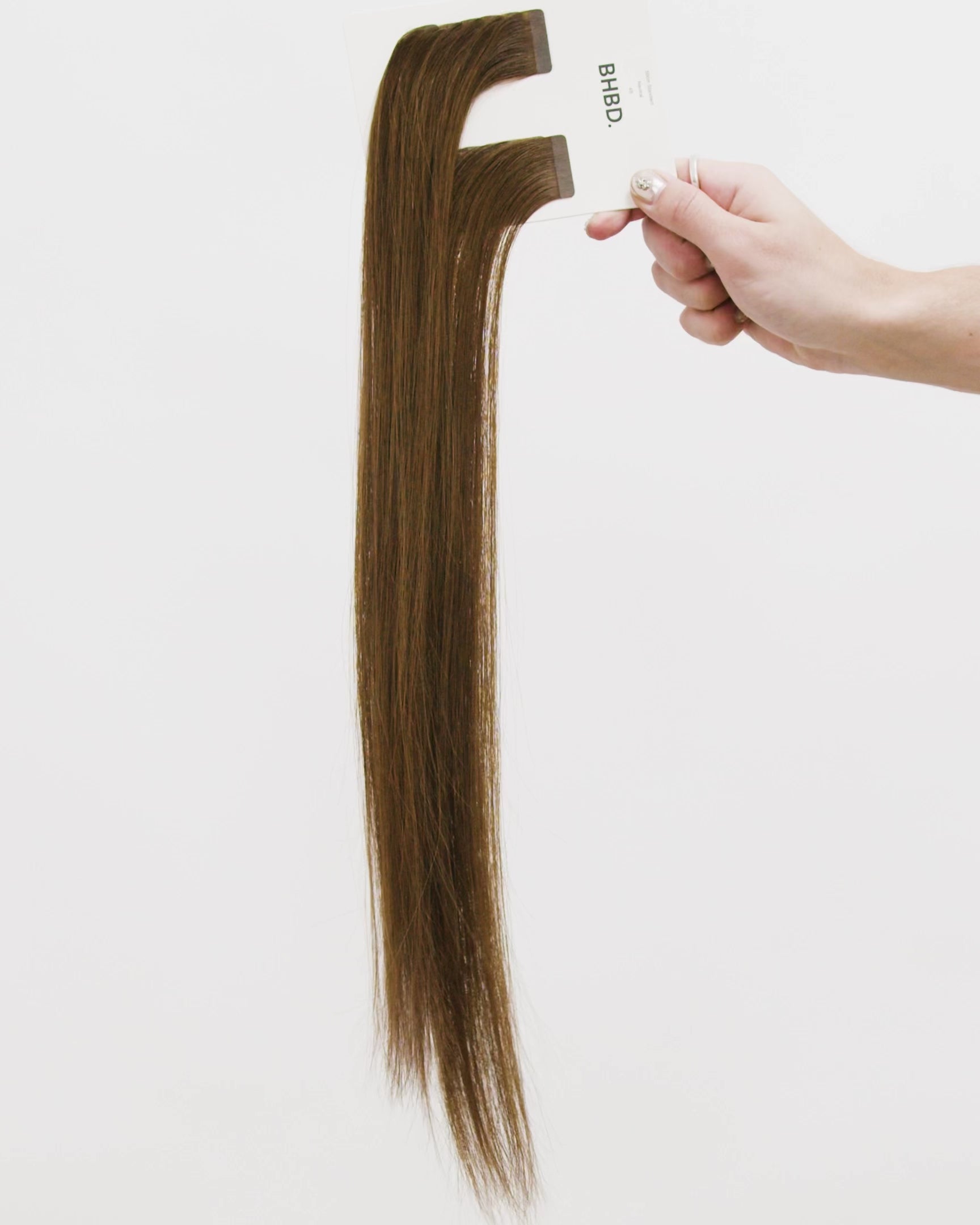 Tape Extensions 4B – pre-taped Remy human hair extensions in dark brown shade; seamless, soft and tangle-free; comes in 35cm, 50cm, and 60cm. 100% Remy hair,