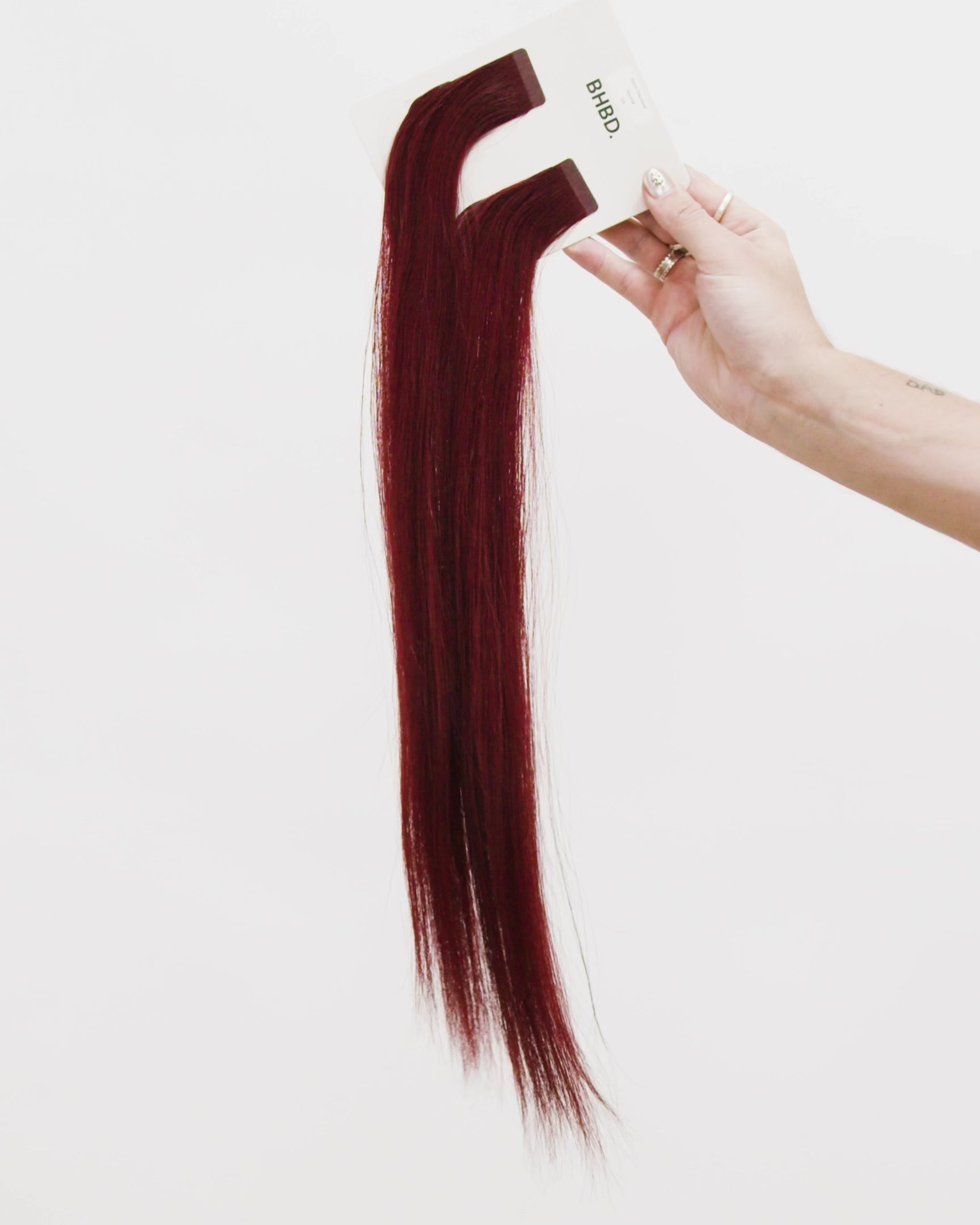 Tape Extensions 5R – pre-taped Remy human hair extensions in medium red shade; seamless, soft and tangle-free; comes in 35cm, 50cm, and 60cm. 100% Remy hair, gentle extensions.