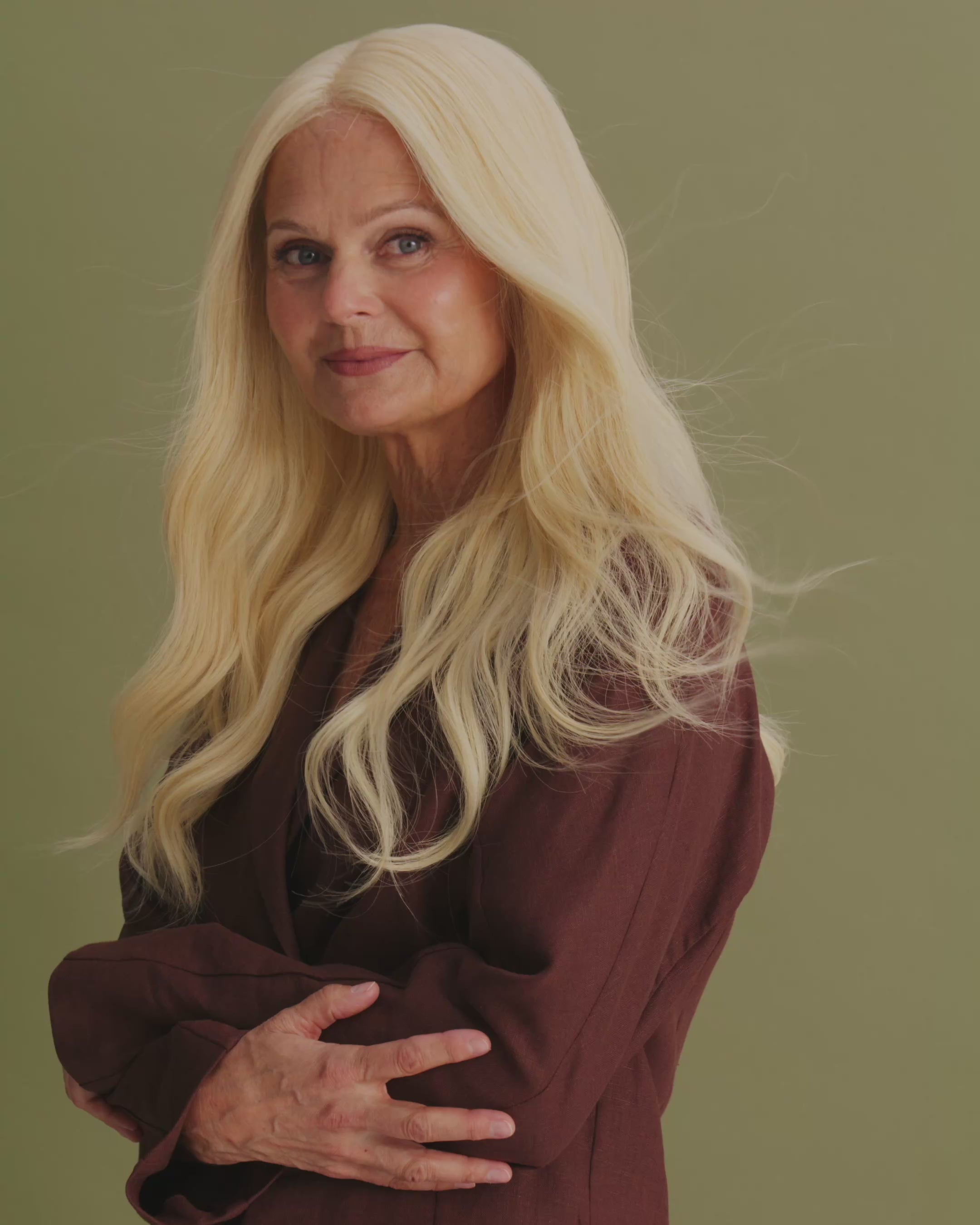 Detailed video showcasing the wig’s lifelike texture and how naturally the hair flows on the model wearing Livia Wig – 40cm light blonde lace wig with soft layered waves; hand-tied Remy hair and bleached knots for natural parting.