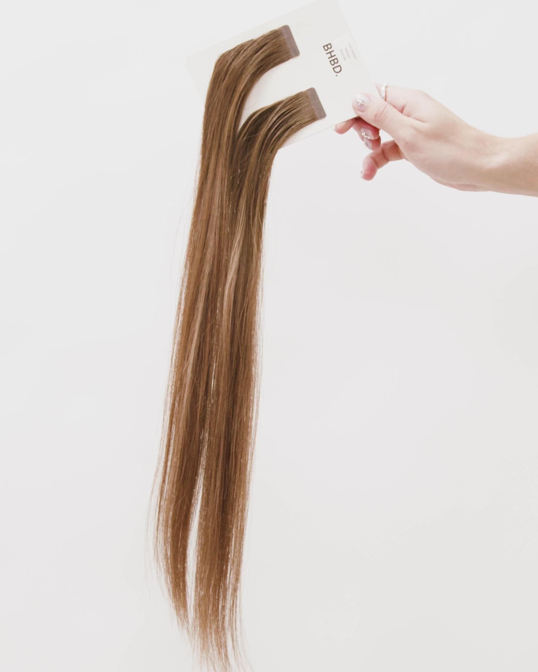 Tape Extensions 6N/6G/9B – pre-taped Remy human hair extensions in natural brown, golden brown, and light beige blonde blend; seamless, soft and tangle-free; comes in 35cm, 50cm, and 60cm. 100% Remy hair, gentle extensions.