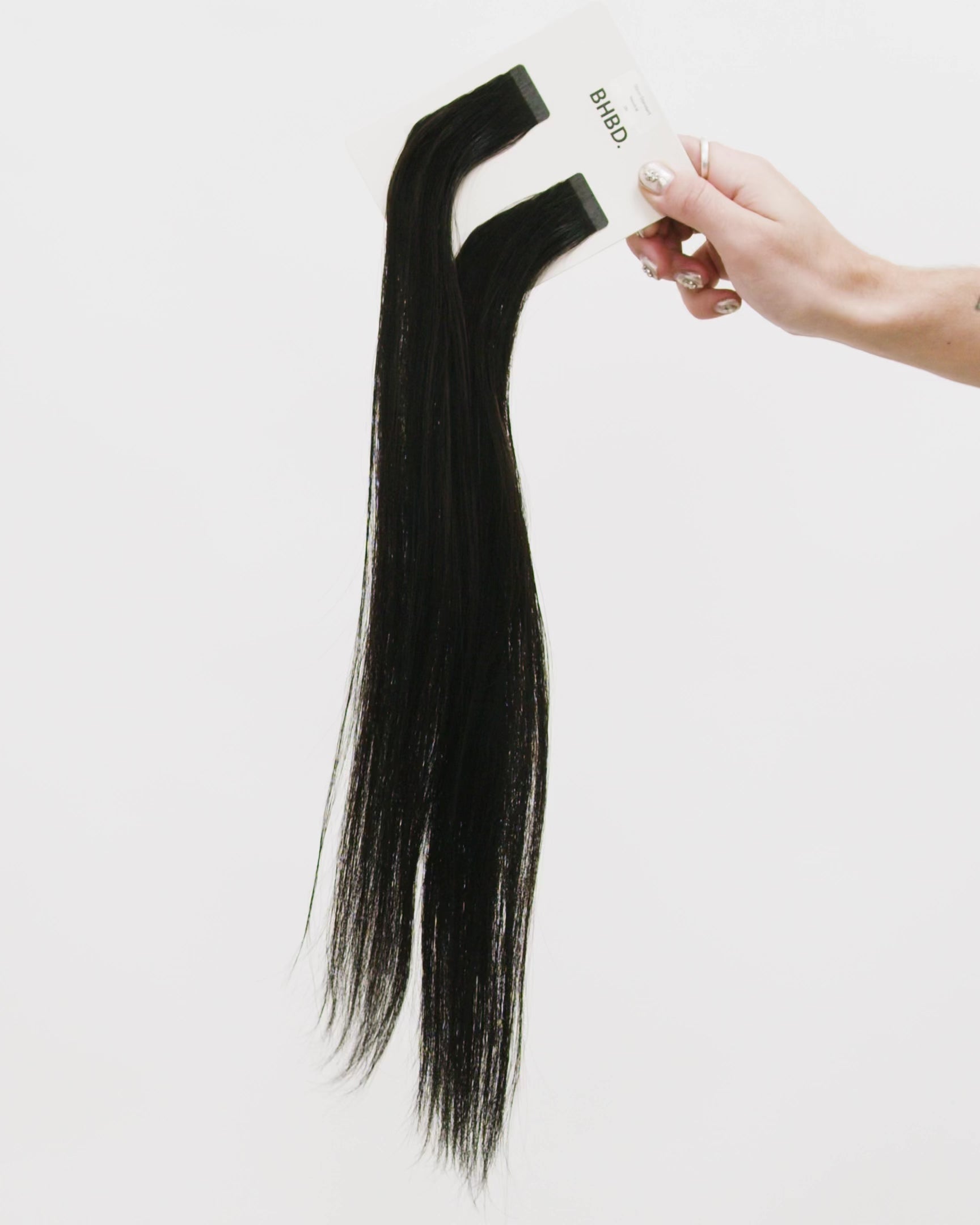 Tape Extensions 3N – pre-taped Remy human hair extensions in dark natural brown shade; seamless, soft and tangle-free; comes in 35cm, 50cm, and 60cm. 100% Remy hair, gentle extensions.