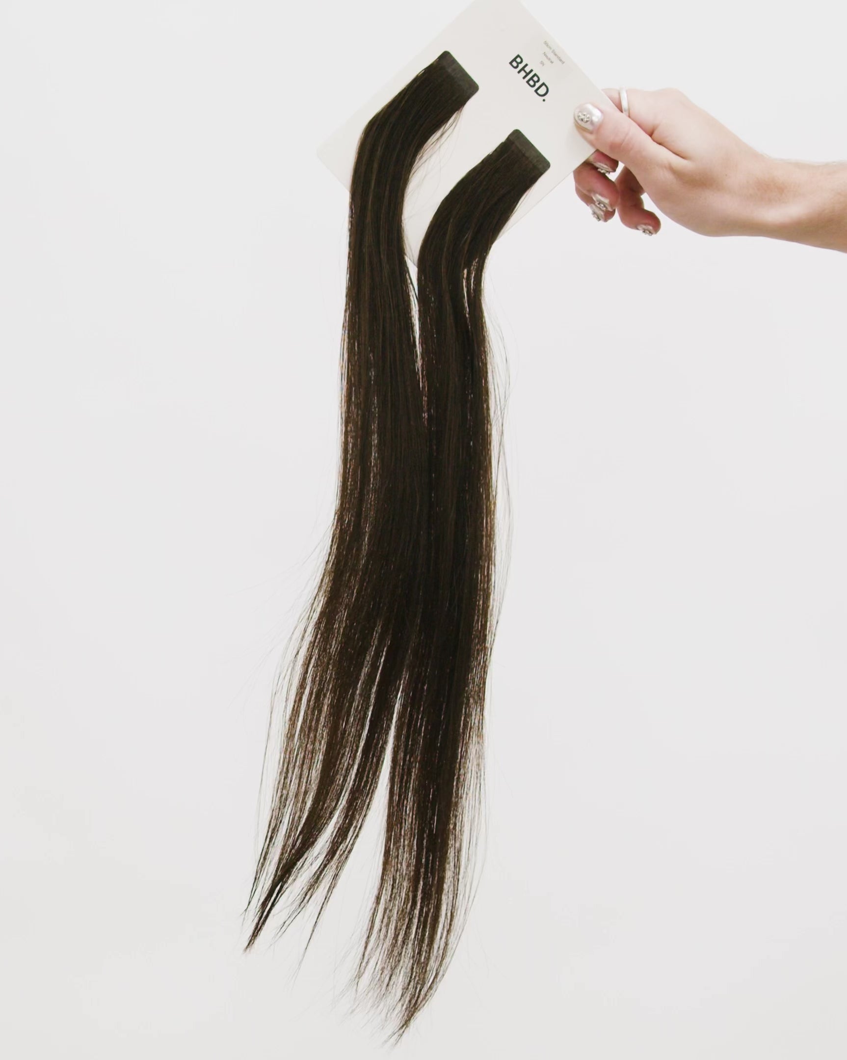 Tape Extensions 5N – pre-taped Remy human hair extensions in medium natural brown shade; seamless, soft and tangle-free; comes in 35cm, 50cm, and 60cm. 100% Remy hair, gentle extensions.