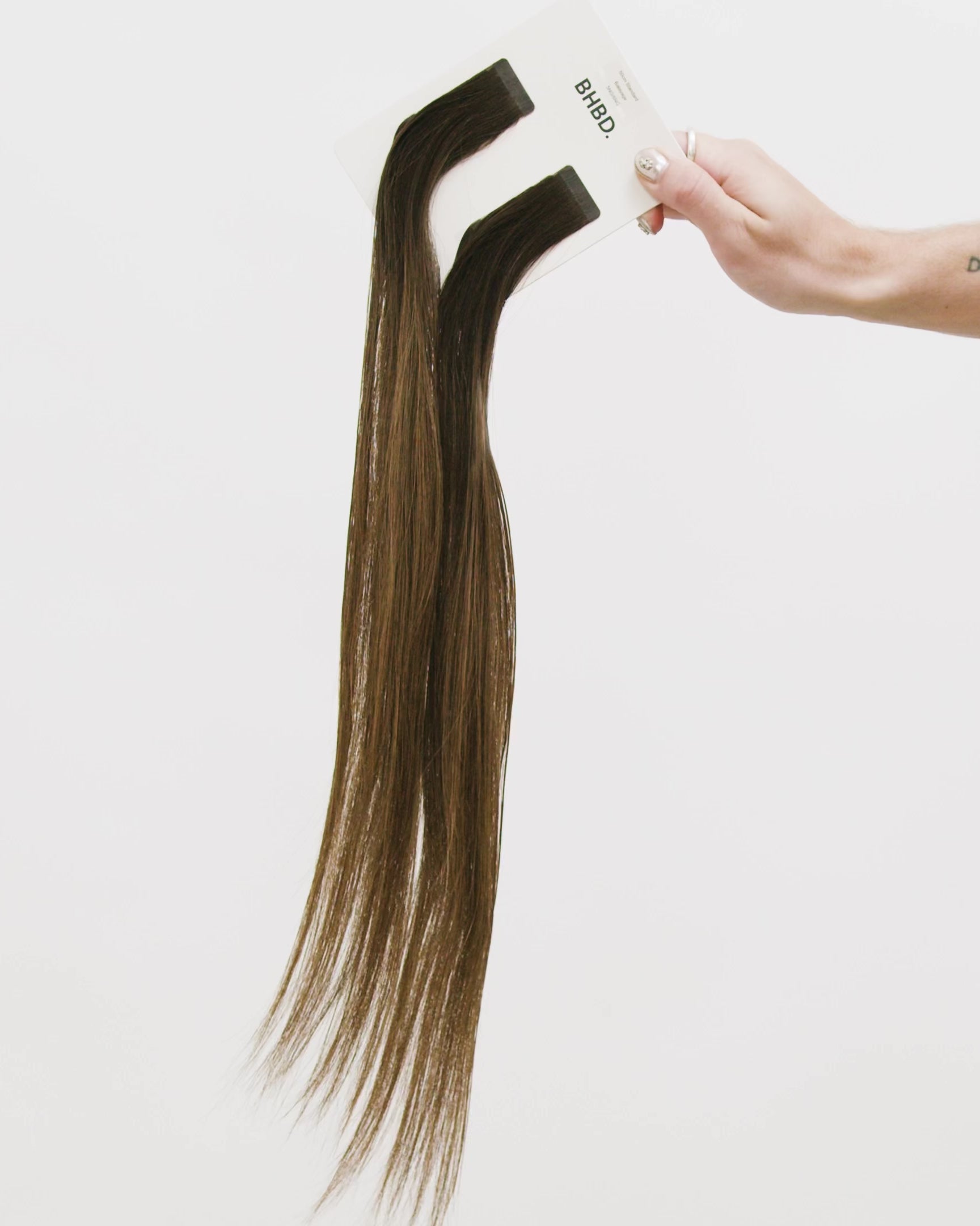 Tape Extensions 5NG/6NG – pre-taped Remy human hair extensions in natural golden brown shades; seamless, soft and tangle-free; comes in 35cm, 50cm, and 60cm. 100% Remy hair, gentle extensions.