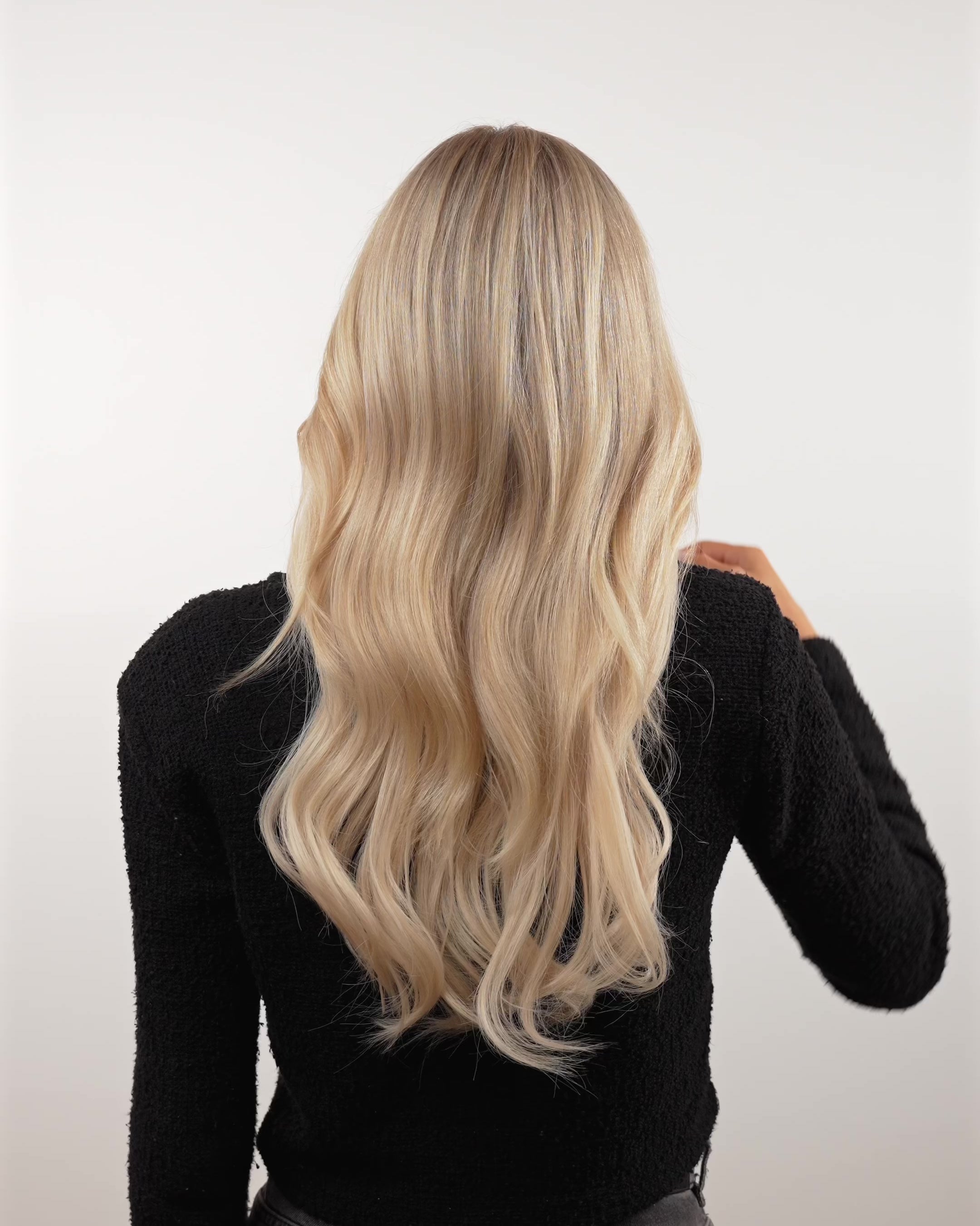 Blond woman removing a BHBD hairband extensions showing with extensions and without from the back and front