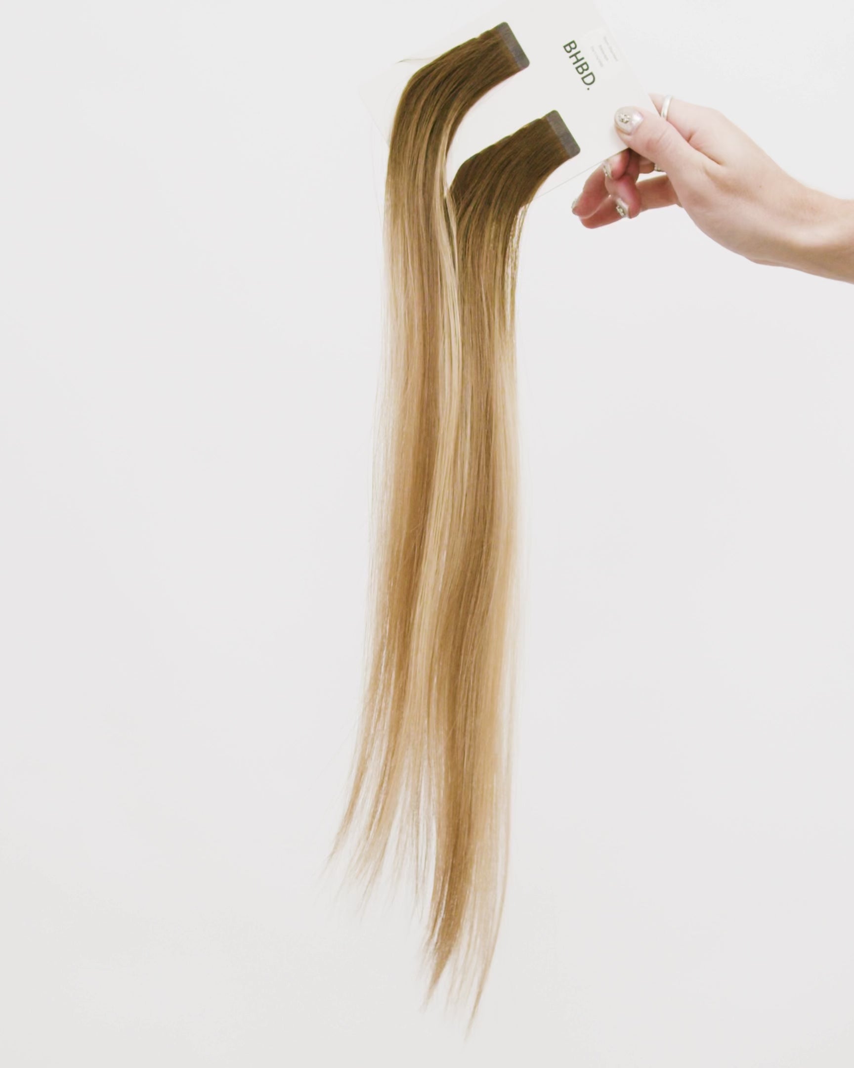 Tape Extensions 6N/11N/9NB – pre-taped Remy human hair extensions in medium natural brown, medium blonde, and natural beige blonde mix; seamless, soft and tangle-free; comes in 35cm, 50cm, and 60cm. 100% Remy hair, gentle extensions.