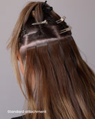 BHBD tape extensions: 35cm, 50cm, 60cm. 100% real Remy hair. Showing how Tape bonds are applied and looks in the hair of a woman.