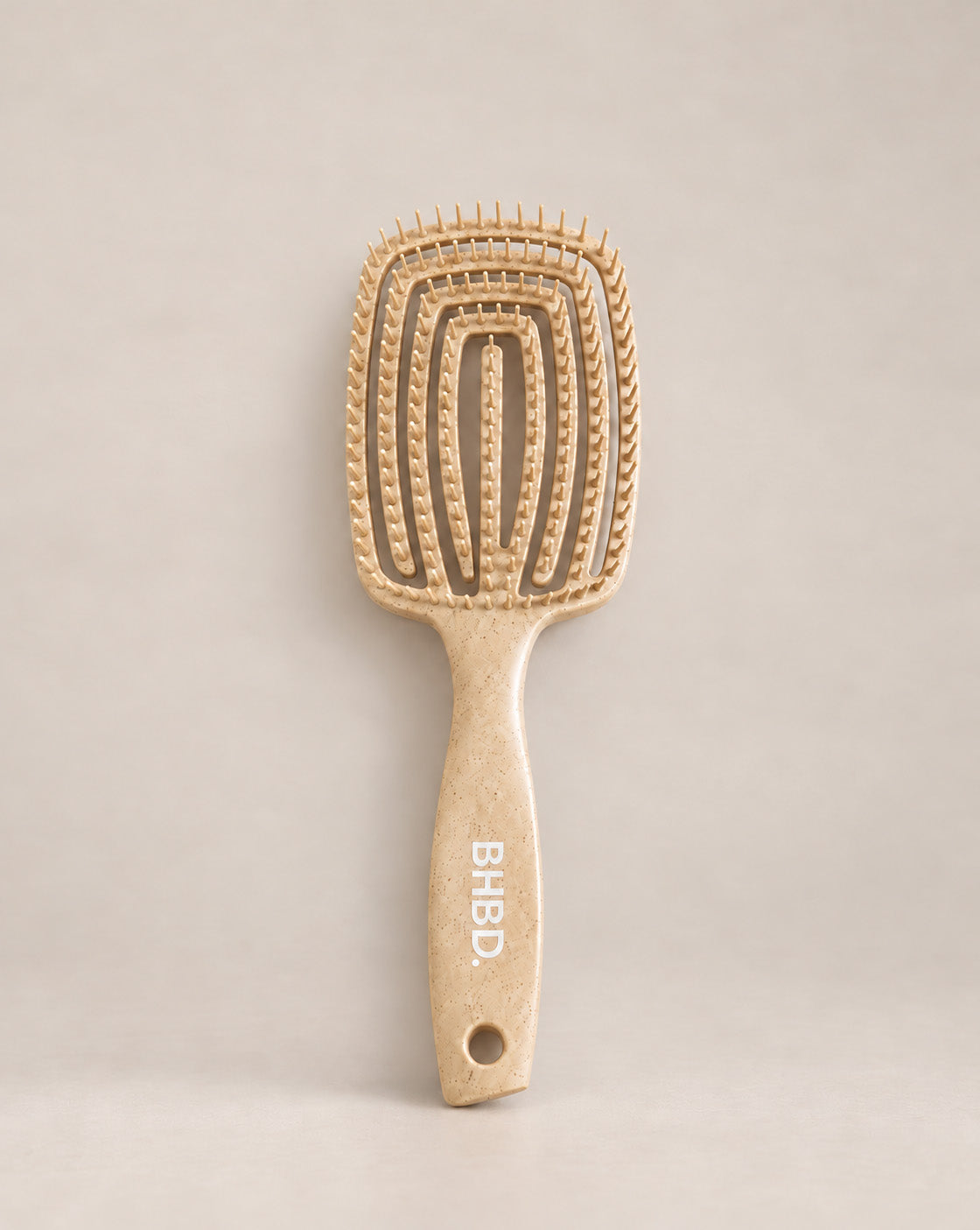 Wet detangler brush with flexible bristles designed to gently detangle wet and dry hair.